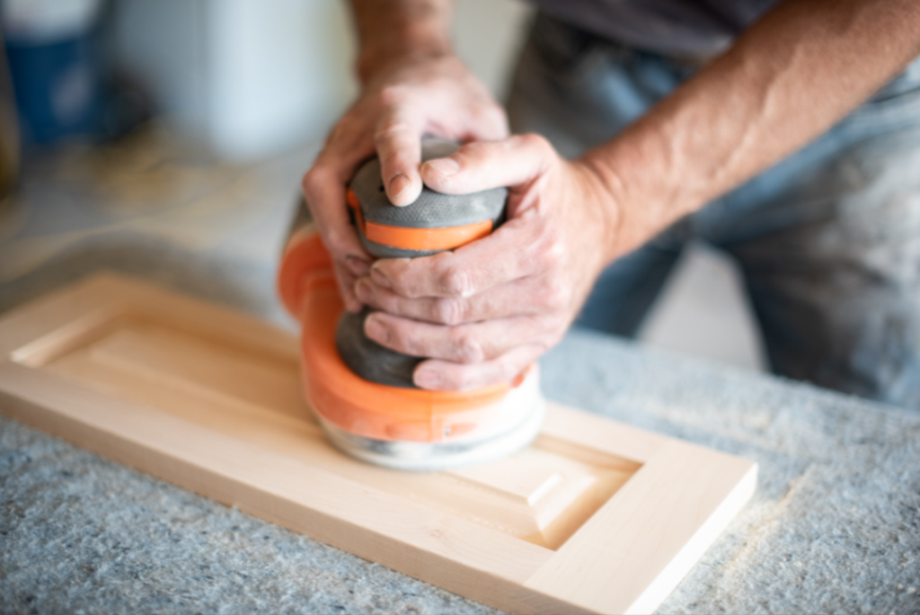 Carpenter hands using power sander The Würth Baer Facts Blog