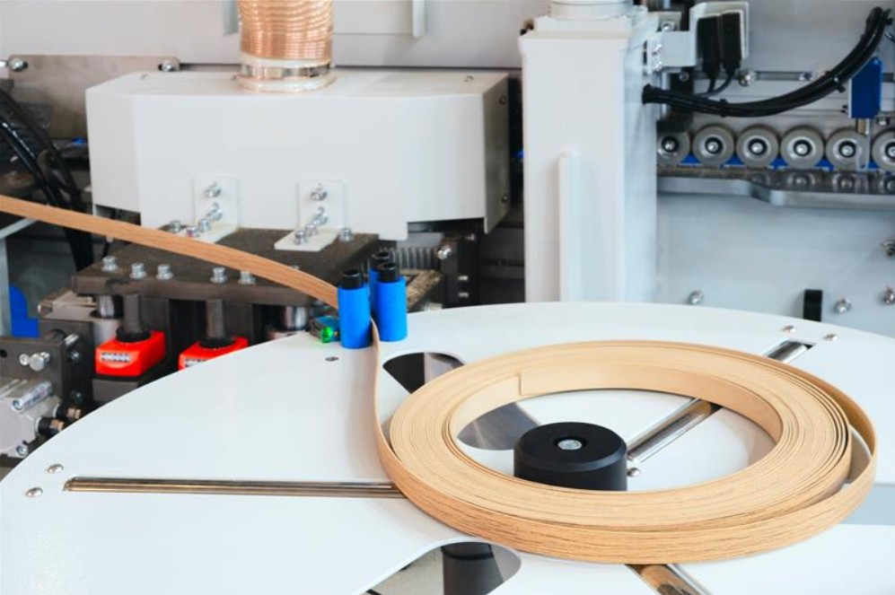 Machine tools for gluing edging onto furniture wood board Edging PVC Photo of cutter machine closeup coil with melamine edge By Aleksandr Matveev The Würth Baer Facts Blog Machine tools for gluing edging onto furniture wood board Edging PVC Photo of cutter machine close up coil with melamine edge By Aleksandr Matveev
