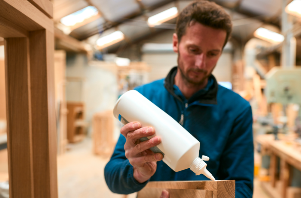 Carpenter In Workshop Joining Wood Together With Glue By Monkey Business The Würth Baer Facts Blog Carpenter In Workshop Joining Wood Together With Glue By Monkey Business